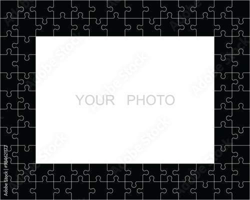 Jigsaw puzzle frame or border made of various black classic style pieces fitting each other photo