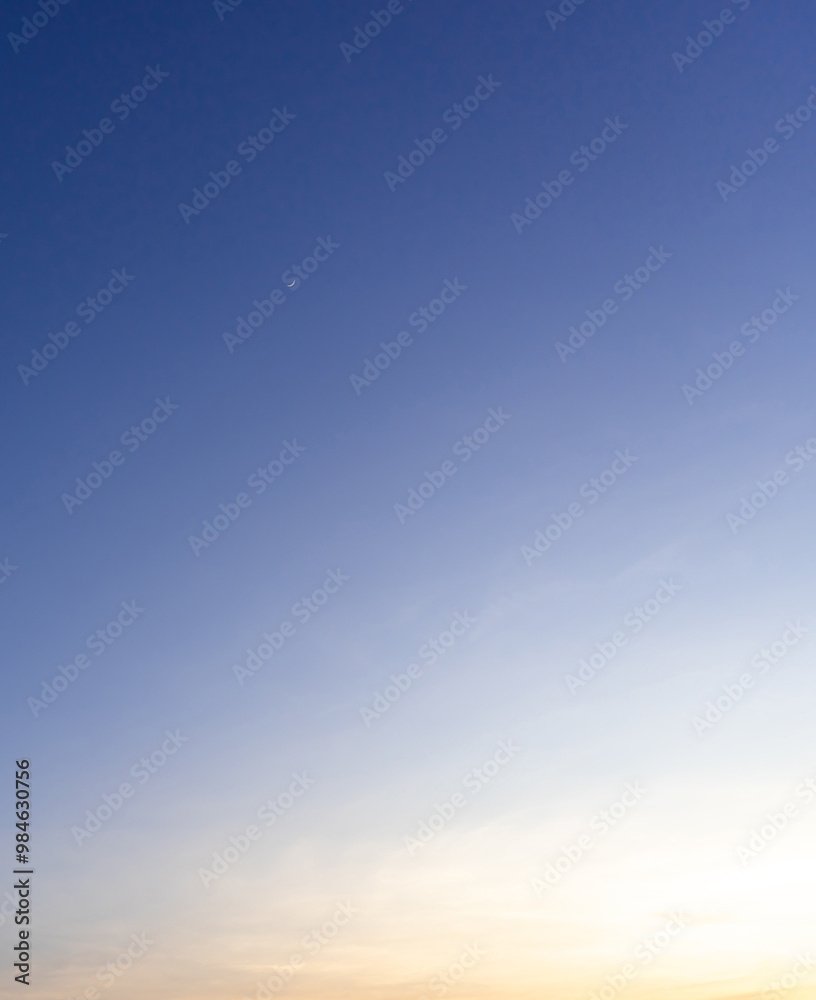 Beautiful morning or evening blue and orange sky while sunsets or sunrises taken at the sea used as natural blackground texture Beautiful morning or evening blue and orange sky while sunsets or sunrises taken at the sea used as natural blackground texture