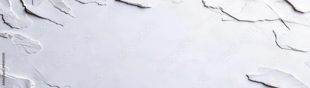Obraz premium The smooth white wall background with a seamless, clean surface Soft natural lighting enhances the minimalist aesthetic, ideal for modern design or photography use