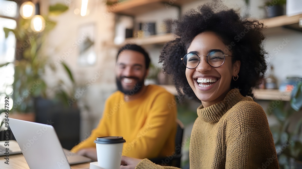 A happy employee having a virtual coffee break with a remote coworker via video call, smiles and positivity on both ends. A happy employee having a virtual coffee break with a remote coworker via video call, smiles and positivity on both ends.