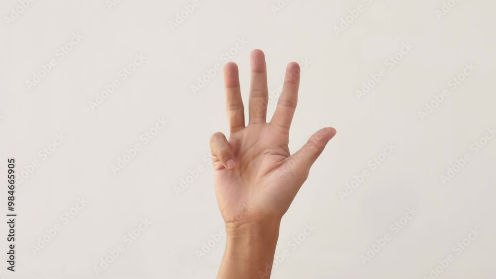 Asian male hands counting numbers one to five on white background. hand gesture of an adult asian man showing the numbers one to five on a white background. 4K slow motion footage. Asian male hands counting numbers one to five on white background. hand gesture of an adult asian man showing the numbers one to five on a white background. 4K slow motion footage.