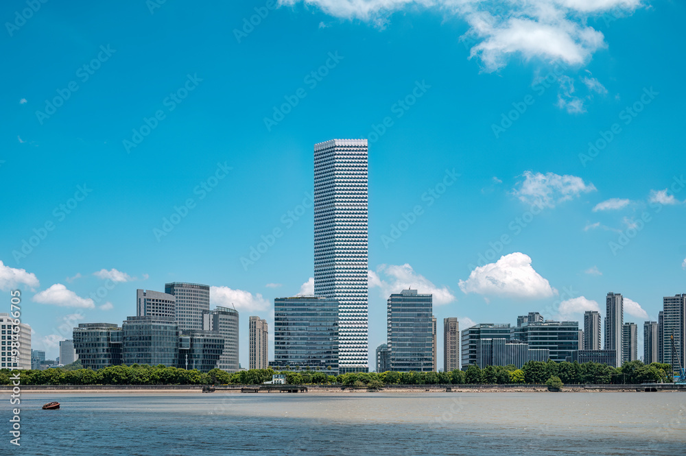 Shanghai's Riverside urban architecture under the blue sky and white clouds. Shanghai's Riverside urban architecture under the blue sky and white clouds.