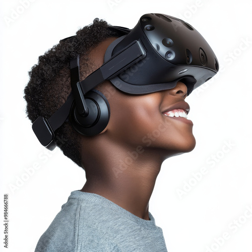 A young boy is immersed in virtual reality experience, wearing VR headset and headphones, showcasing excitement and joy. His expression reflects thrill of technology and gaming