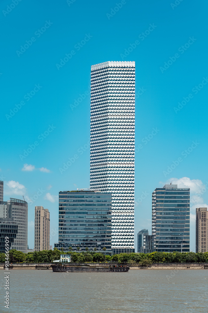 Shanghai's Riverside urban architecture under the blue sky and white clouds. Shanghai's Riverside urban architecture under the blue sky and white clouds.