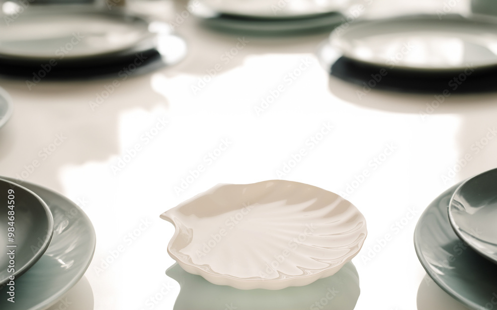 Fototapeta premium Several ceramic plates on a table in a restaurant, macro.