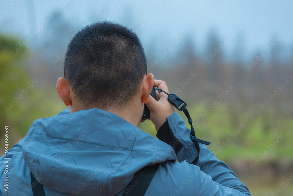 Chongming District, Shanghai - Portrait of a man standing in the forest Chongming District, Shanghai - Portrait of a man standing in the forest
