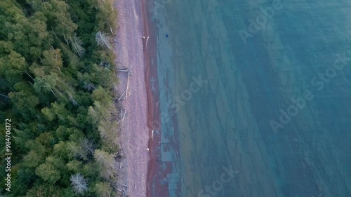 Lake Superior Shoreline on the Keewenaw Peninsula - Pan Up and Reverse Flight Over the Water photo