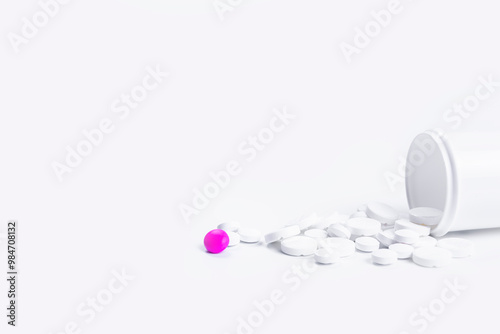 The image features white pills in a white bottle, with a striking pink pill standing out. This visually appealing setup is popular in health-related searches online. Ideal for showcasing pharmaceutica photo