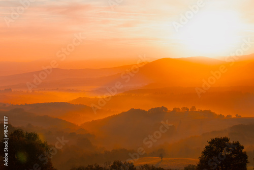 A wonderful view of the sun rays on the mountain at sunrise.