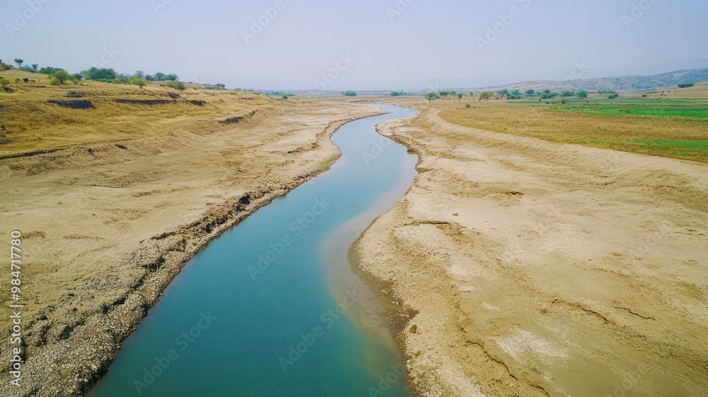 Water scarcity due to climate change, with dry rivers and communities struggling to find clean water sources Water scarcity due to climate change, with dry rivers and communities struggling to find clean water sources
