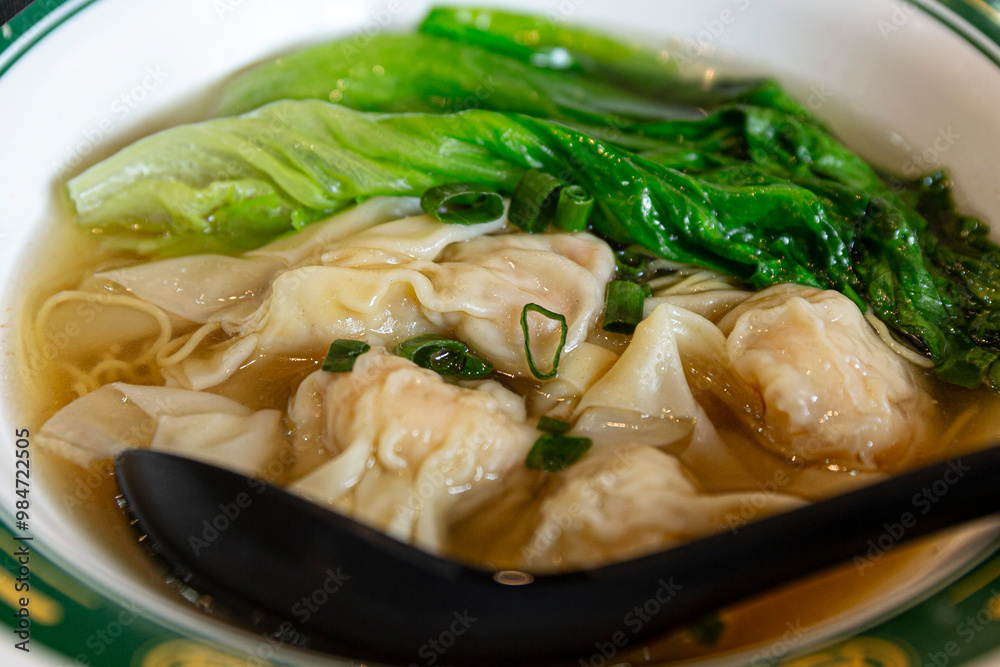 Delicious Hong Kong Wonton Noodle Soup with Fresh Green Bok Choy and Savory Broth, Perfect Comfort Food Delicious Hong Kong Wonton Noodle Soup with Fresh Green Bok Choy and Savory Broth, Perfect Comfort Food