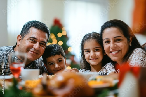 Wallpaper Mural Thanksgiving day Happy latin family smiling while having thanksgiving dinner at home Torontodigital.ca