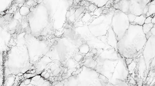 Elegant white marble surface with subtle gray veining, perfect for luxurious interiors and modern designs.