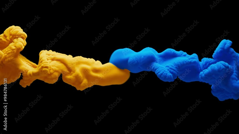 Slow motion 3D animation of yellow and blue thick smoke. With Alpha Channel. Two smokes move towards each other, mixing with each other, forming thick multi-colored puffs of smoke, similar to clouds.