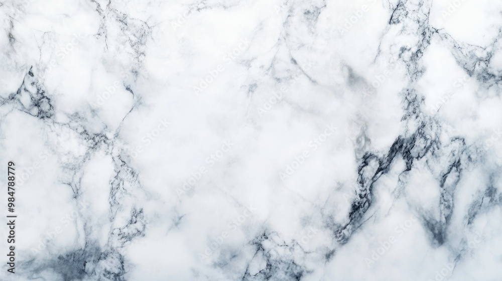 Fototapeta premium Elegant white marble texture with subtle gray veining, perfect for backgrounds and interior design aesthetics.