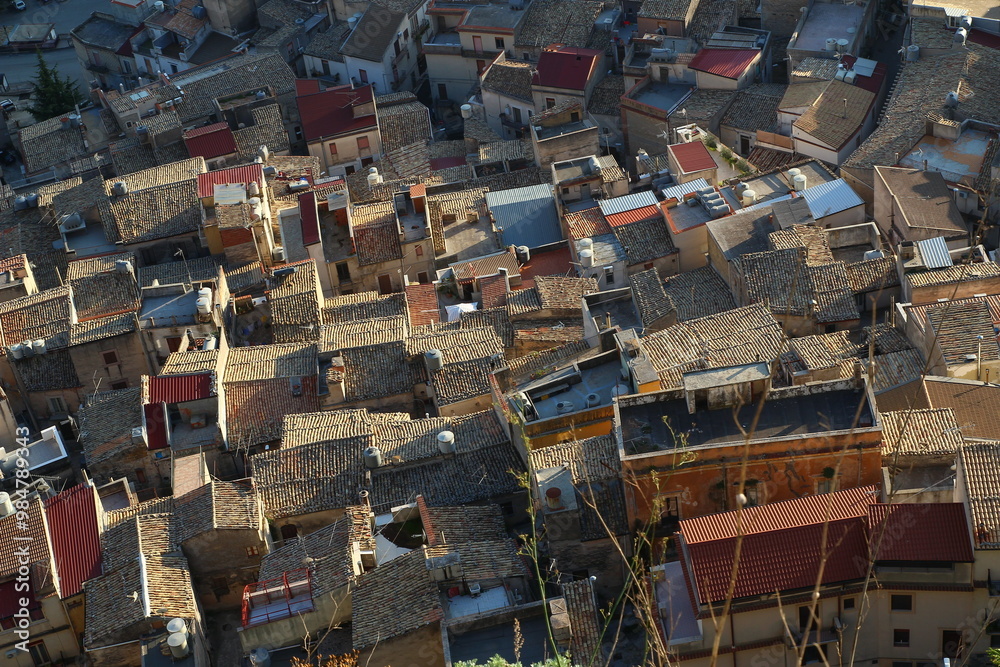Late afternoon at the end of October: the low light illuminates the many roofs of Caltabellotta (Sicily, Italy) Late afternoon at the end of October: the low light illuminates the many roofs of Caltabellotta (Sicily, Italy)