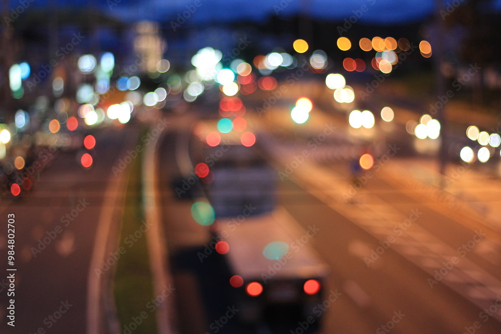 City Lights in Motion Blur: A mesmerizing view of urban traffic at twilight, with blurred headlights and streetlights painting a vibrant tapestry of city life. City Lights in Motion Blur: A mesmerizing view of urban traffic at twilight, with blurred headlights and streetlights painting a vibrant tapestry of city life.