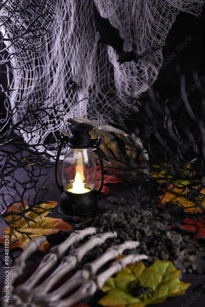 Fototapeta premium Halloween. Creepy screensaver. Decor for the holiday Halloween. Bony hands on the ground among the black branches