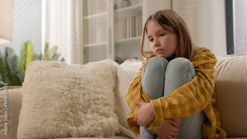 Tableau sur toile Unhappy stressful depressed caucasian girl schoolgirl sad alone at home thinking