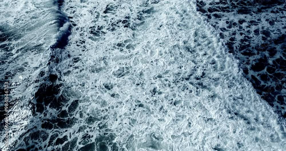Top-view sea waves (Big power sea ocean wave Dark blue) Cinematic scene aerial view drone flying top-down of sea water big wave. Shot on cinema cam. DCI4K 4096x2160p. High quality footage ProRes422 Top-view sea waves (Big power sea ocean wave Dark blue) Cinematic scene aerial view drone flying top-down of sea water big wave. Shot on cinema cam. DCI4K 4096x2160p. High quality footage ProRes422