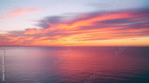 Stunning sunset over ocean with vibrant warm hues painting sky at twilight