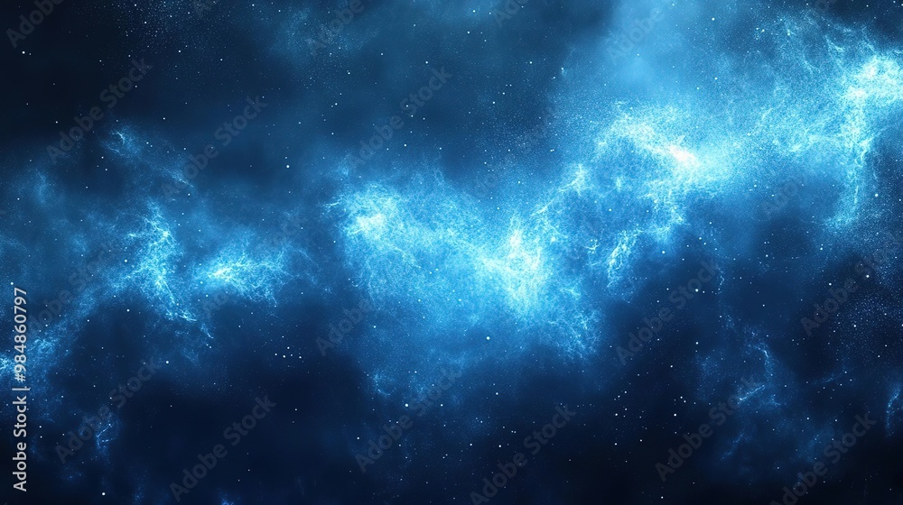 Fototapeta premium A stunning cosmic scene featuring swirling blue nebulae illuminated by starlight, perfect for space-themed projects.