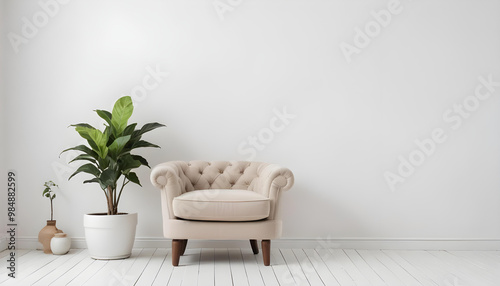 Simple, minimalist interior featuring a beige armchair, white walls, and potted indoor plants on a bright wooden floor 