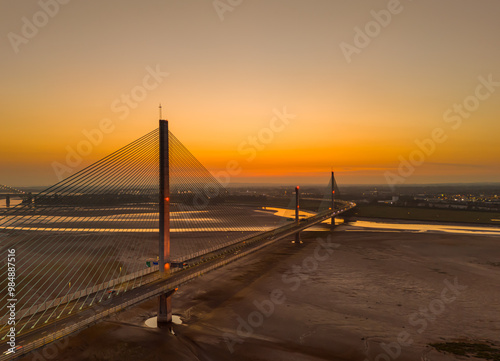 Liverpool, Merseyside, UK, September 18, 2024; aerial view of the Mersey Gateway toll bridge with stunning sun set over the River Mersey, Liverpool, UK. photo