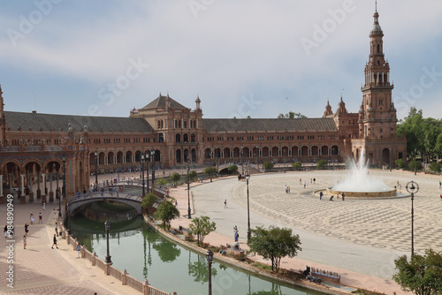 Tourists visiting plaza de espana on sunny day in seville spain