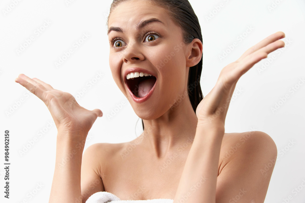 Excited young woman expressing joy and surprise with open hands, white background, natural lighting, cheerful mood, perfect for concepts of happiness and emotional reactions Excited young woman expressing joy and surprise with open hands, white background, natural lighting, cheerful mood, perfect for concepts of happiness and emotional reactions