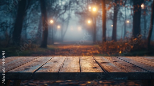 Wooden table on the background of the evening foggy park photo