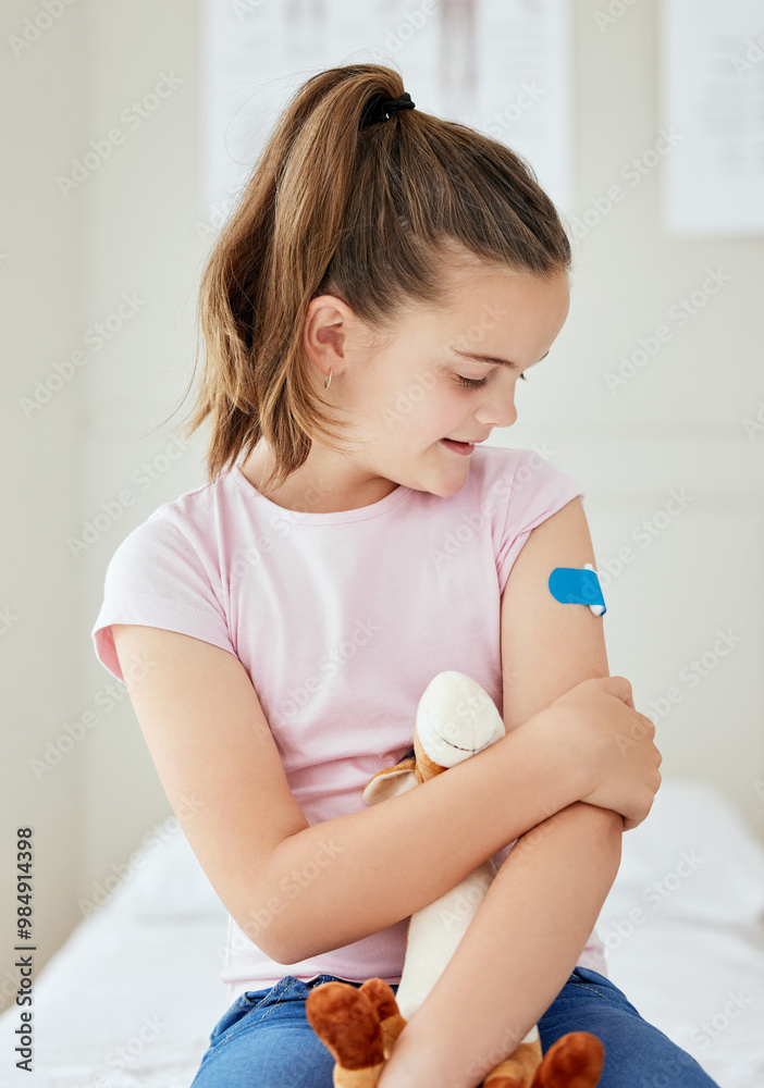 Girl, child and hospital plaster for vaccine, stuffed animal and bandage for virus treatment. Female person, teddy bear and bandaid for immunization booster, pediatrician clinic and trust in flu shot Girl, child and hospital plaster for vaccine, stuffed animal and bandage for virus treatment. Female person, teddy bear and bandaid for immunization booster, pediatrician clinic and trust in flu shot