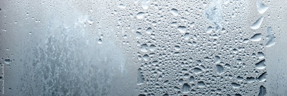 Frosted glass texture with condensation droplets forming an abstract pattern Frosted glass texture with condensation droplets forming an abstract pattern