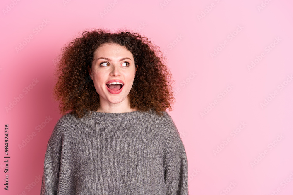 Photo portrait of pretty young girl look excited empty space wear trendy gray outfit isolated on pink color background Photo portrait of pretty young girl look excited empty space wear trendy gray outfit isolated on pink color background