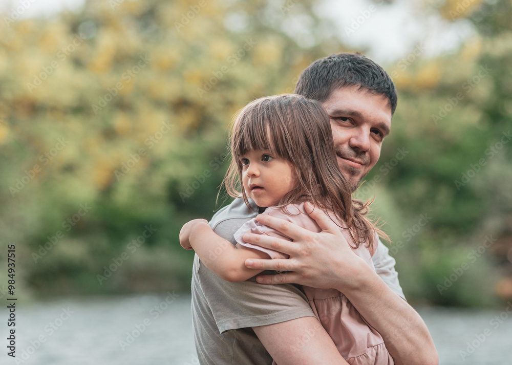 Fototapeta premium A father hugs his daughter