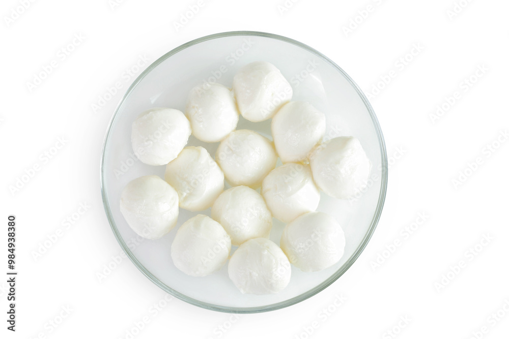 Mini mozzarella balls in a glass bowl isolated on white background with full depth of field. Top view. Flat lay. Mini mozzarella balls in a glass bowl isolated on white background with full depth of field. Top view. Flat lay.