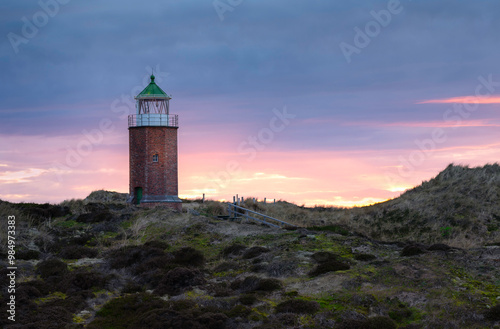 Lighthouse Rotes Kliff at sunset photo