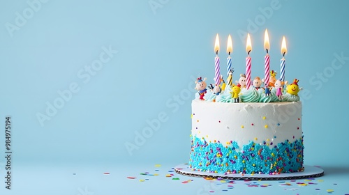 Delicious Birthday Cake with Six Lit Candles and Colorful Cupcakes for a Joyful Celebration photo