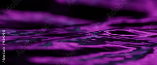 Smooth rhythmic rippling sea waves of purple blue flowing by in a slow motion looped time lapse. 4k ultrawide 2:39:1 cinemascope aspect ratio, shallow depth of field lens blur.