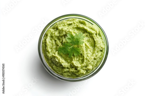 Glass bowl of guacamole on white background. Top view. File contains clipping path.