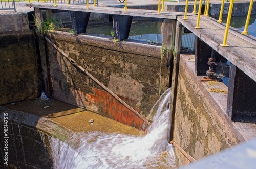 Close-up of canal lock gate with water flow