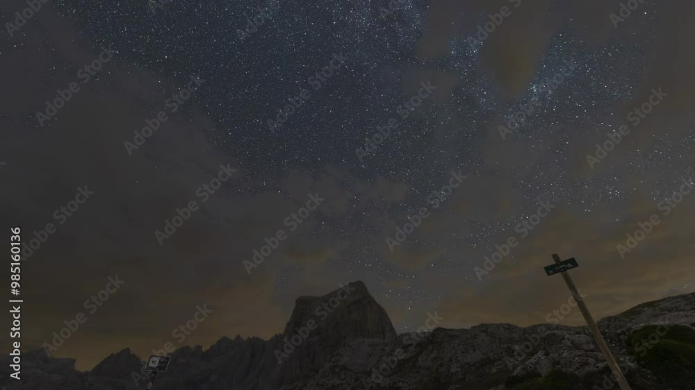 Timelapse of a crashed car between passing clouds in El Cable, in the Picos de Europa National Park Timelapse of a crashed car between passing clouds in El Cable, in the Picos de Europa National Park