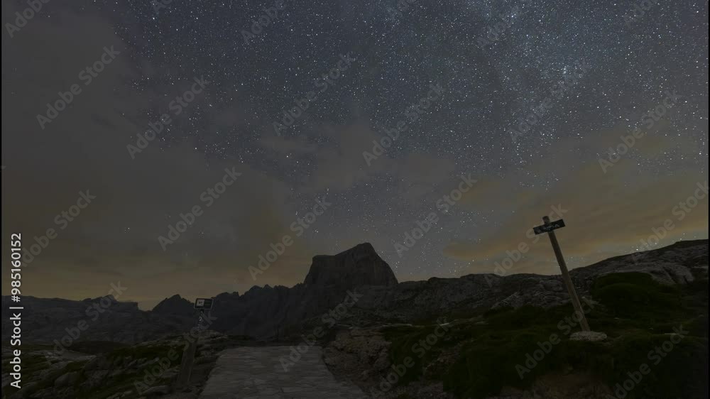 Timelapse of a crashed car between passing clouds in El Cable, in the Picos de Europa National Park Timelapse of a crashed car between passing clouds in El Cable, in the Picos de Europa National Park