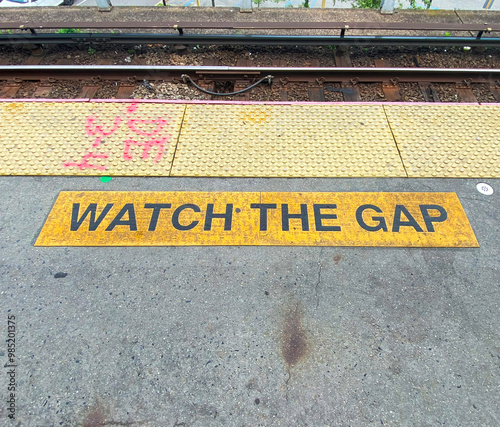 Watch the gap on a railroad platform photo