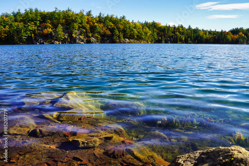 Magnificent glass like Pink lake, a Meromictic lake siuated inside Gatineau Park,Quebec,Canada showcases the beauty of Canada's fall season  photo