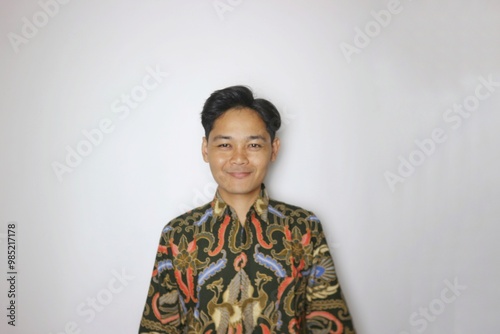 Handsome Indonesian man wearing batik with various expressions isolated white background photo