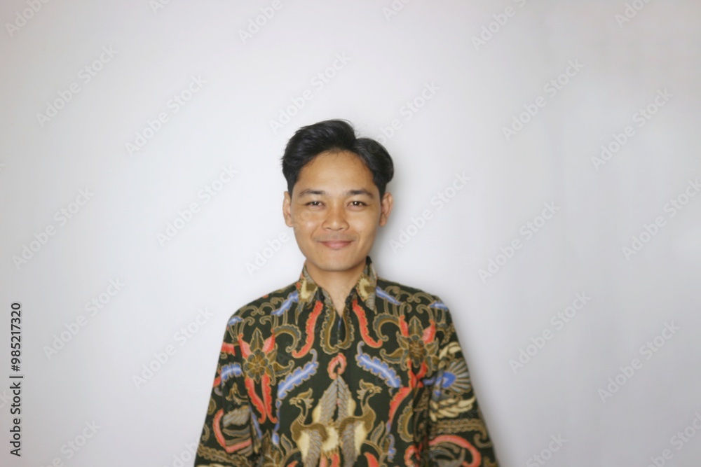 Handsome Indonesian man wearing batik with various expressions isolated white background Handsome Indonesian man wearing batik with various expressions isolated white background