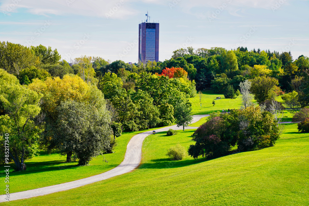Stunning views of the winding trails set amidst verdant gardens, contrasting with the yellows and red of the change of seasons to Fall seen here at the scenic Dominion Arboretum,Ottawa,Ontario,Canada Stunning views of the winding trails set amidst verdant gardens, contrasting with the yellows and red of the change of seasons to Fall seen here at the scenic Dominion Arboretum,Ottawa,Ontario,Canada