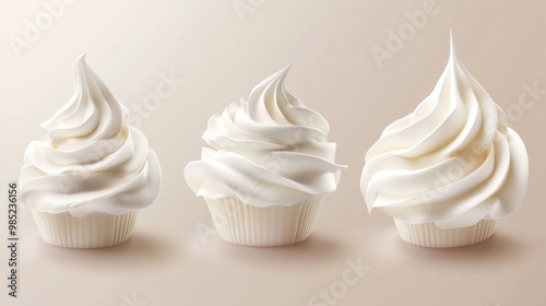 Three cupcakes with fluffy white frosting.