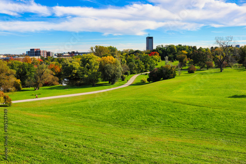 Magnificent views of the trails set amidst verdant gardens, contrasting with the yellows and red of the change of seasons to Fall seen here at the scenic Dominion Arboretum,Ottawa,Ontario,Canada 